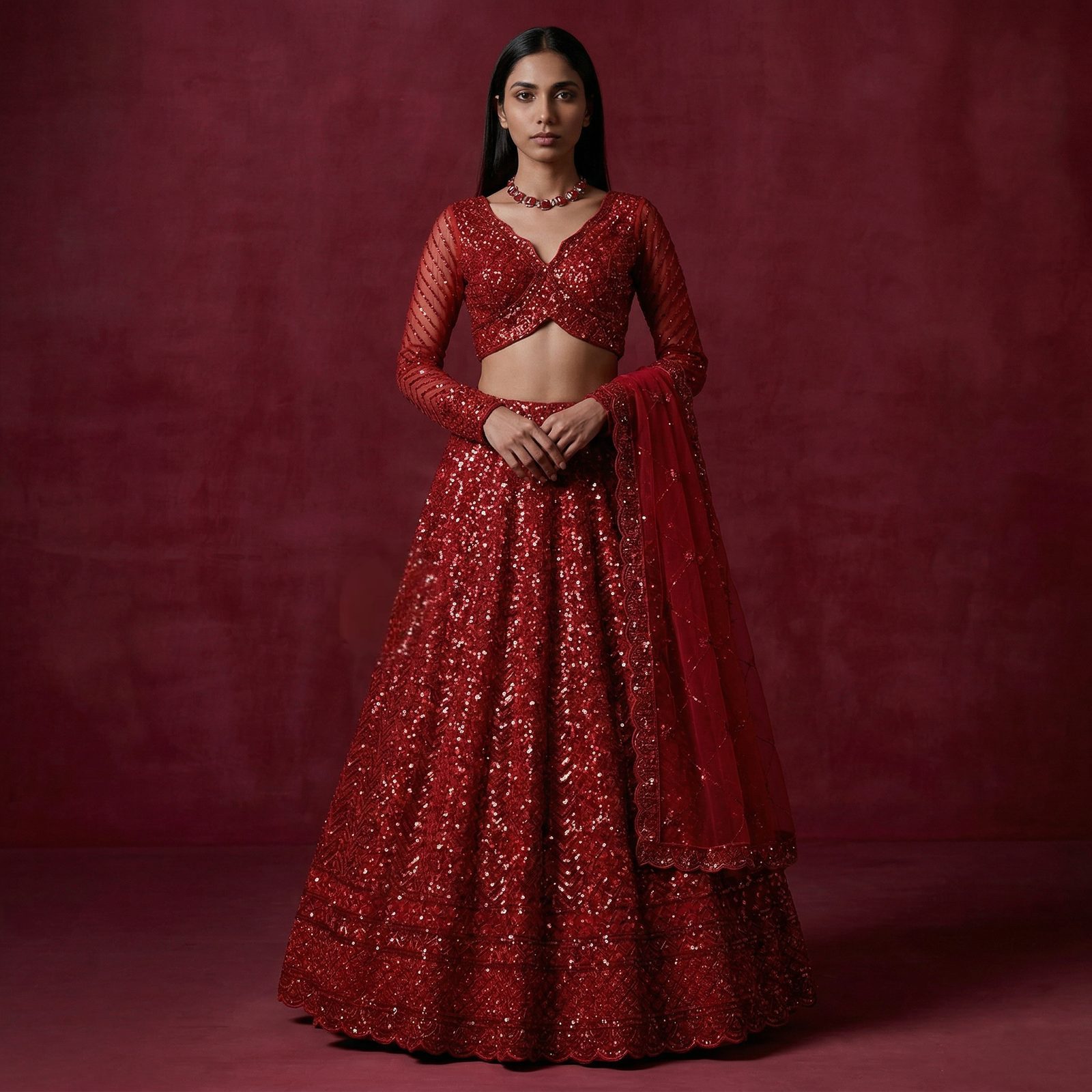 JMS Studio model in a red hand-embroidered couture lehenga